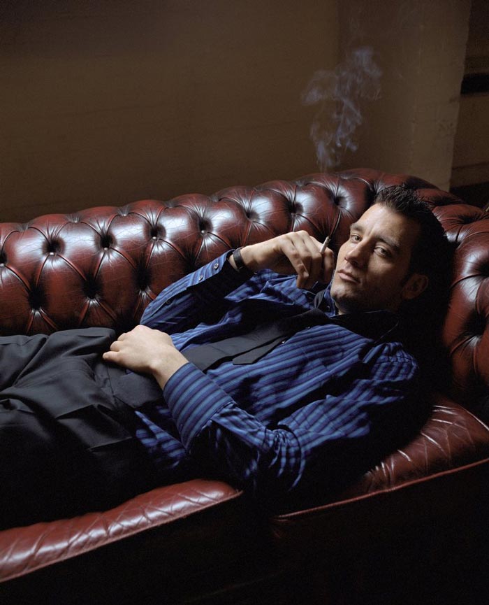 man lying sofa smoking