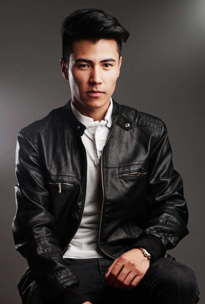 man wearing leather jacket long hair